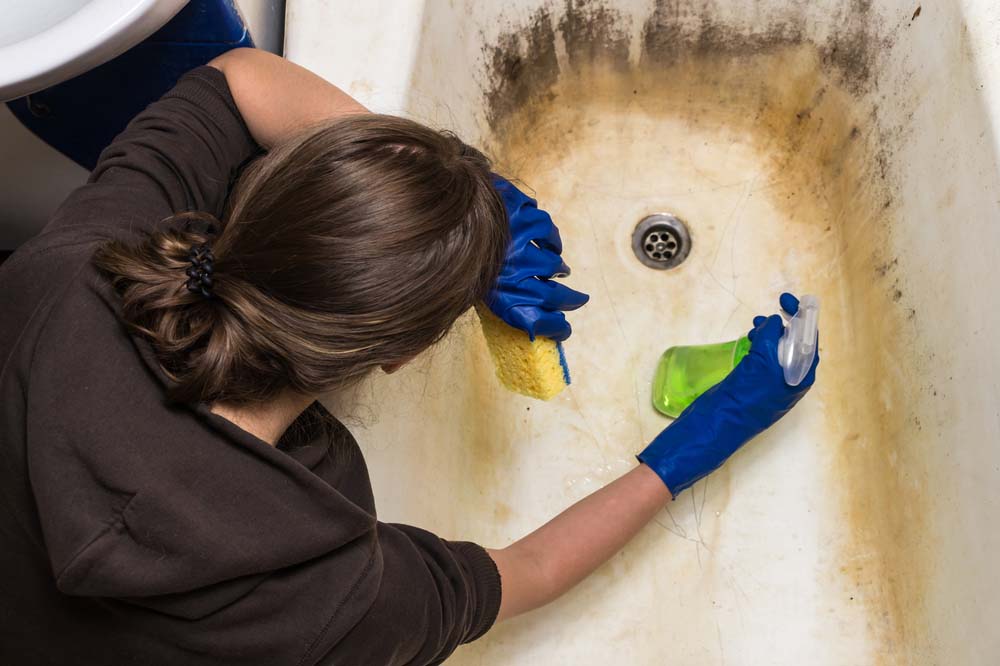 housewife cleaning old dirty bathtub San Diego, CA