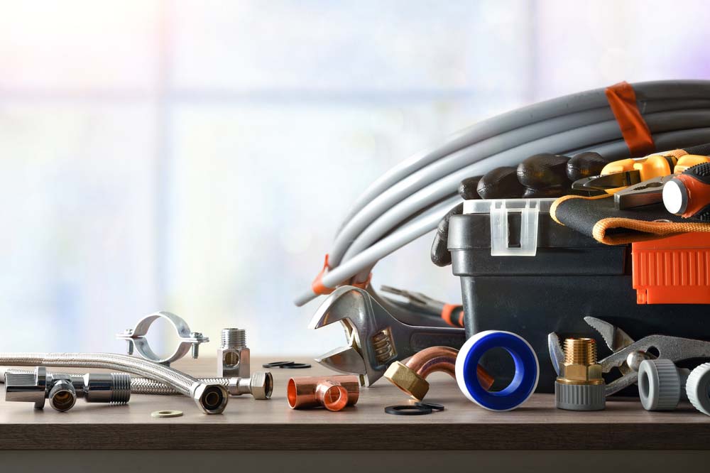 various basic plumbing tools strewn about